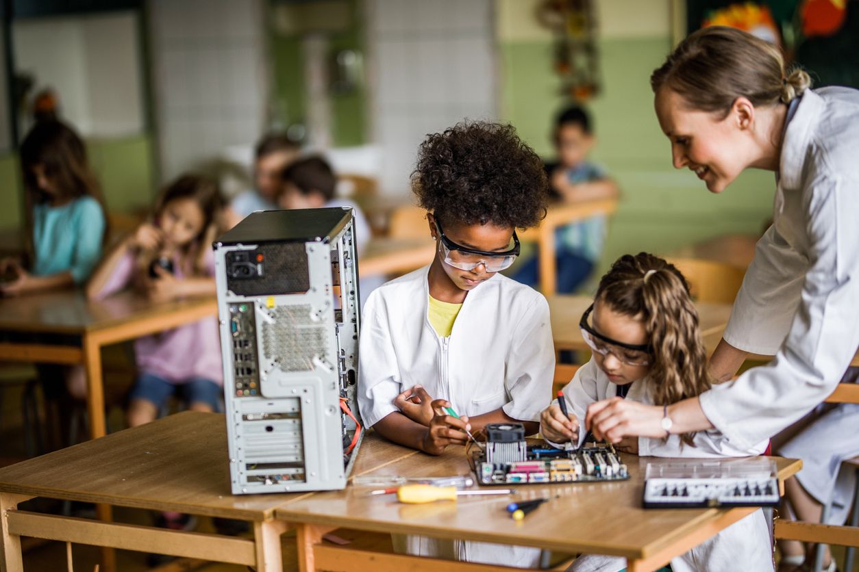 Girls programming a robot made of legos at Techspark Academy, Switzerland
