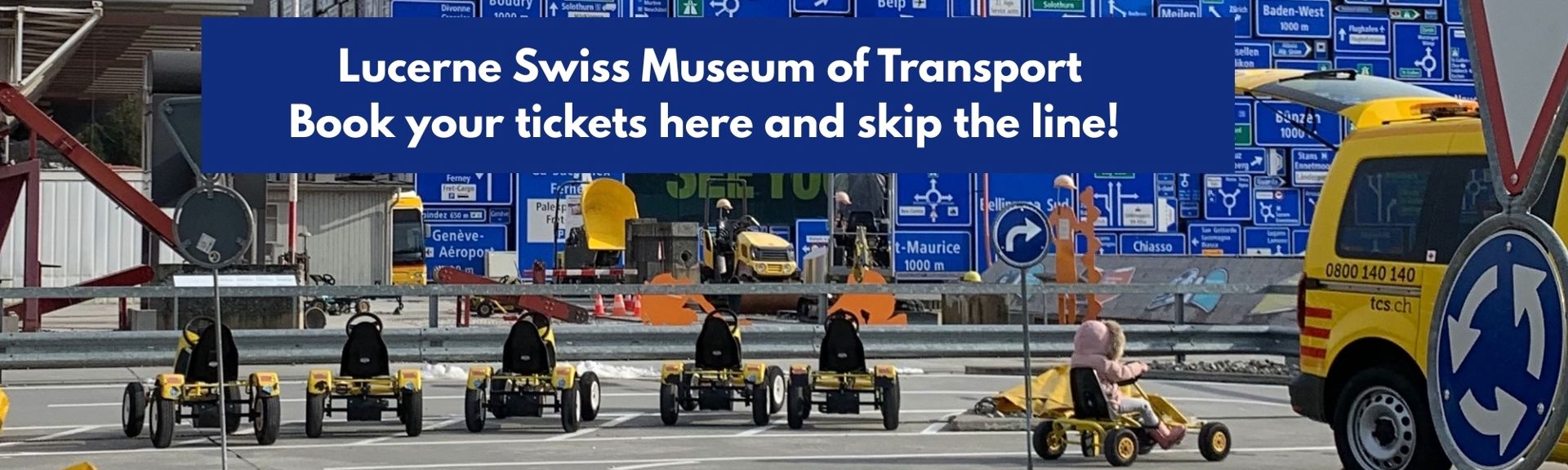 Banner promoting the Lucerne Swiss Museum of Transport with the text “Book your tickets here and skip the line!” above a scene of small pedal go-karts lined up on a mock road course, with traffic signs, construction equipment, and a child riding a go-kart in the foreground.