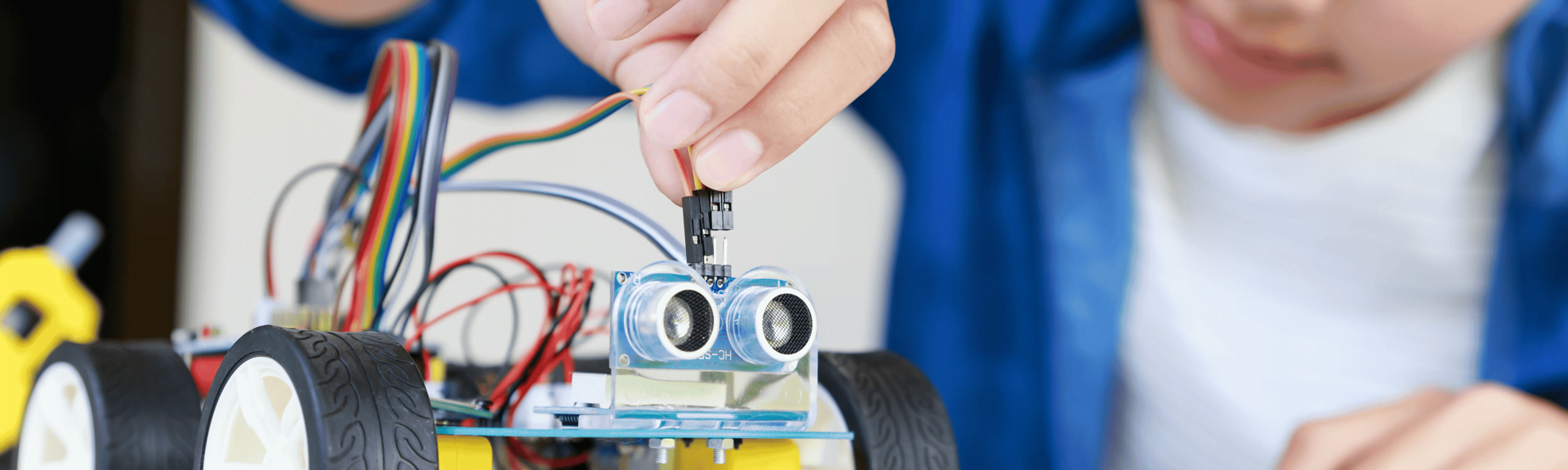 A boy making a robot at Codora after-school classes in Zurich, Switzerland