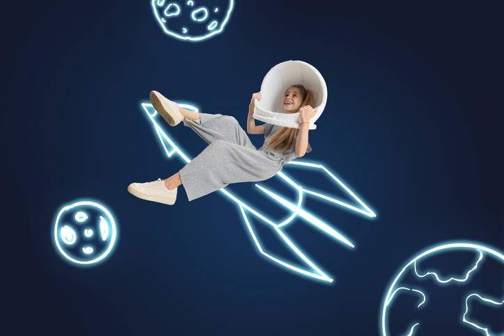 A young girl on an imaginary spacerocket at the adventure rooms in Luzern