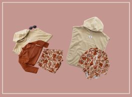Two coordinated clothing sets arranged on a solid rose-pink background with a lighter peach-toned border. The left set includes a beige long-sleeved shirt, a matching beige baseball cap with sunglasses, a rust-colored jacket, and patterned shorts with a botanical print. The right set features a light beige hooded poncho, a patterned button-up shirt with a botanical print, and a cohesive earthy color palette.