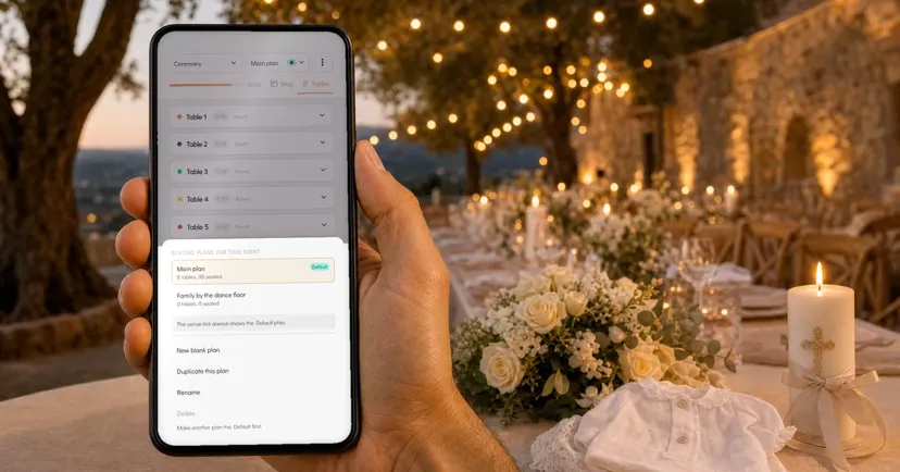 A hand holding a phone with an event's seating plans, the main plan and a second one, on an estate terrace with a bridal bouquet, a baptism candle and a christening outfit