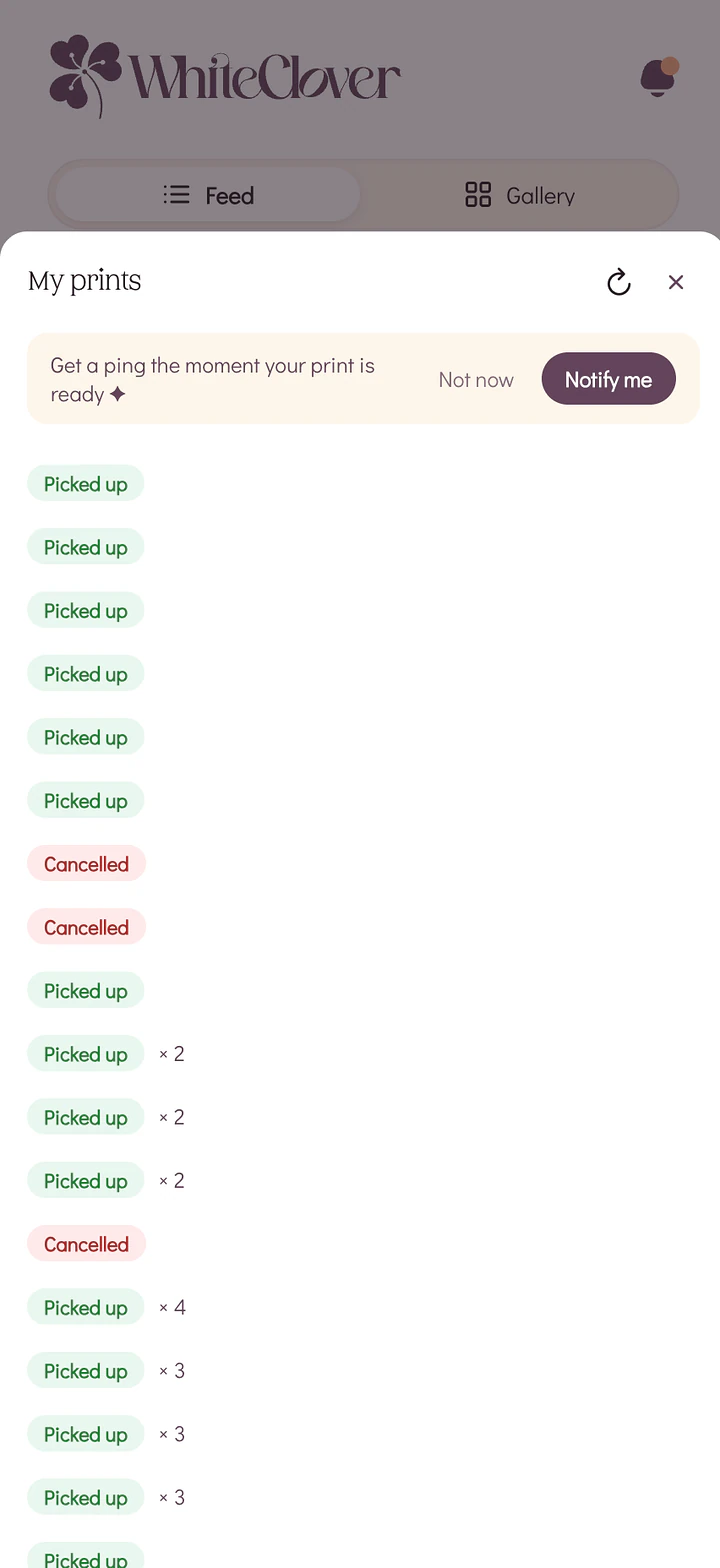 The My Prints screen on a phone listing a guest's print jobs with picked up status labels