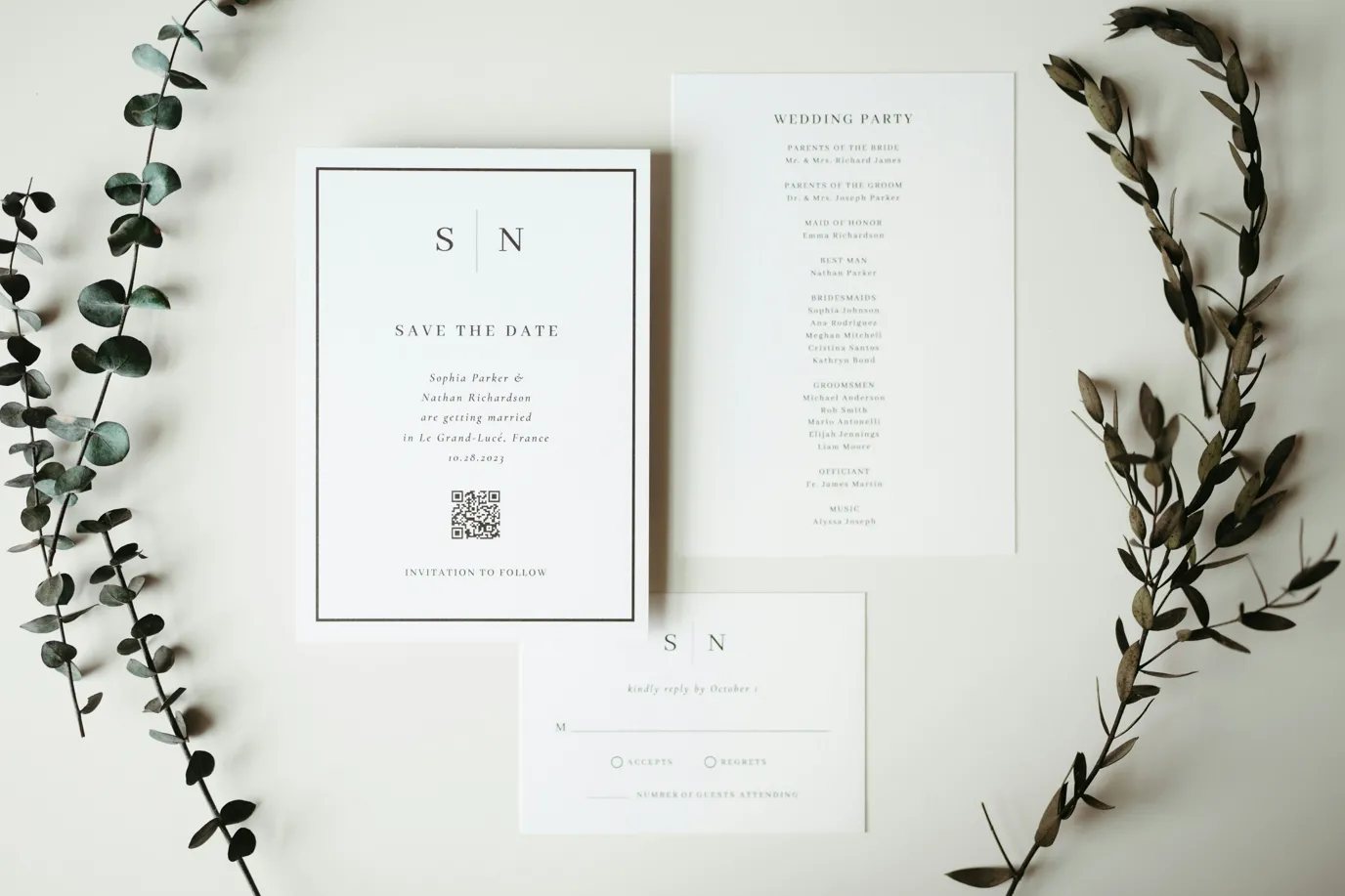 A couple of cards and some flowers on a table.