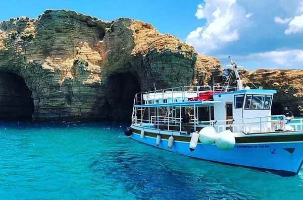 Mavros G Boat Tours traditional boat by the sea caves of Koufonisia